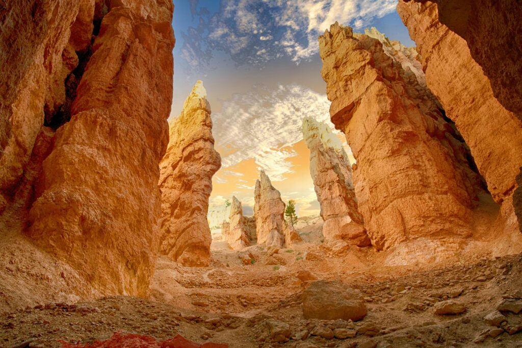 Breathtaking view of towering sandstone formations under a dramatic sky, showcasing natural erosion.